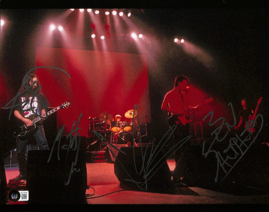 Soundgarden 11x14 Concert Photo Signed by 4 Beckett: Soundgarden 11x14 Concert Photo Signed by 4 Beckett This 11x14 concert photograph features the legendary rock band Soundgarden performing live under dramatic red lighting. The photo has been hand-sign