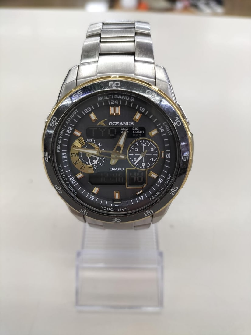 CASIO OCW-T400 Oceanus mens titanium wristwatch solar radio-controlled: CASIO OCW-T400 Oceanus mens titanium wristwatch solar radio-controlled Pre-owned Casio Oceanus OCW-T400 men's wristwatch with a gold x black design. This Japan-made watch features a titanium case and 