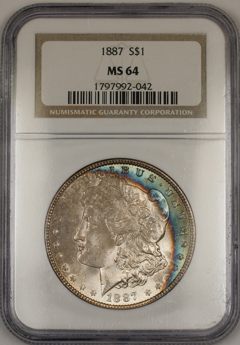 NGC MS 64 1887 Morgan Silver Dollar with Toned Rim: NGC MS 64 1887 Morgan Silver Dollar with Toned Rim 1887 Morgan Silver Dollar $1 coin graded NGC MS-64. This uncirculated United States silver coin features beautifully toned crescent rim toning on bot