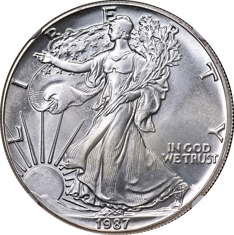 1987 Silver American Eagle $1 NGC MS67 ERROR Obverse Struck Thru: 1987 Silver American Eagle $1 NGC MS67 ERROR Obverse Struck Thru This original 1987 Silver American Eagle $1 coin, certified by NGC as MS67 ERROR, showcases exceptional eye appeal with a brilliant lus