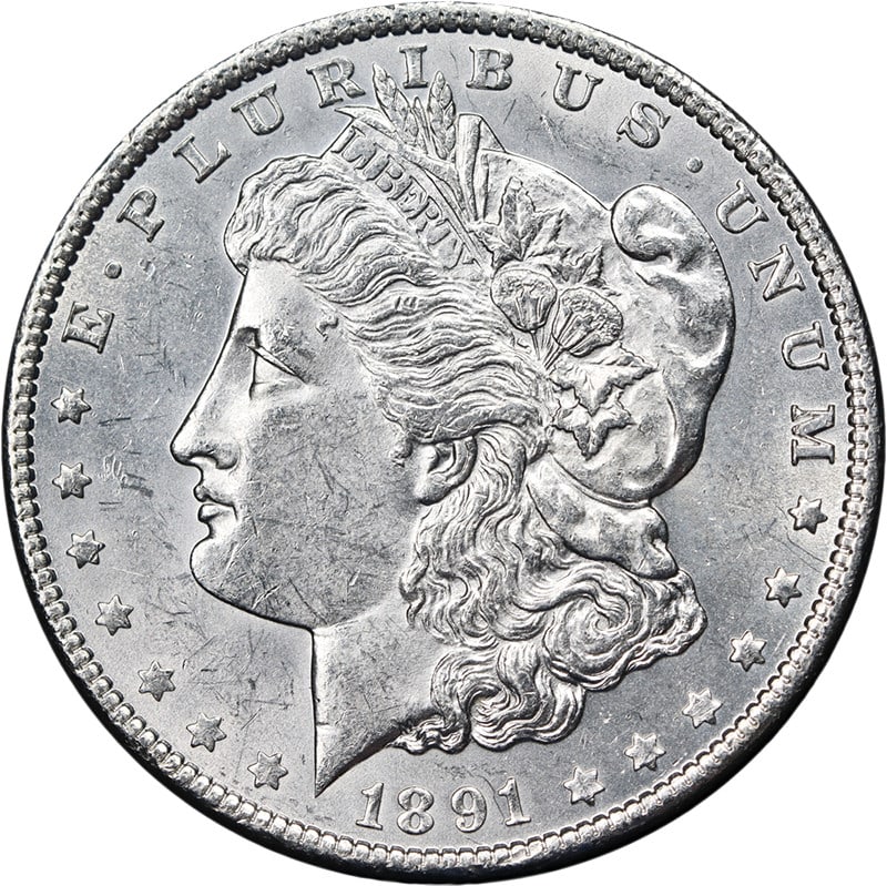 1891-P Morgan Silver Dollar Bright White Nice Strike BU: 1891-P Morgan Silver Dollar Bright White Nice Strike BU This 1891-P Morgan Silver Dollar is an uncirculated coin featuring bright white luster, attractive eye appeal, and a strong strike. It is compos