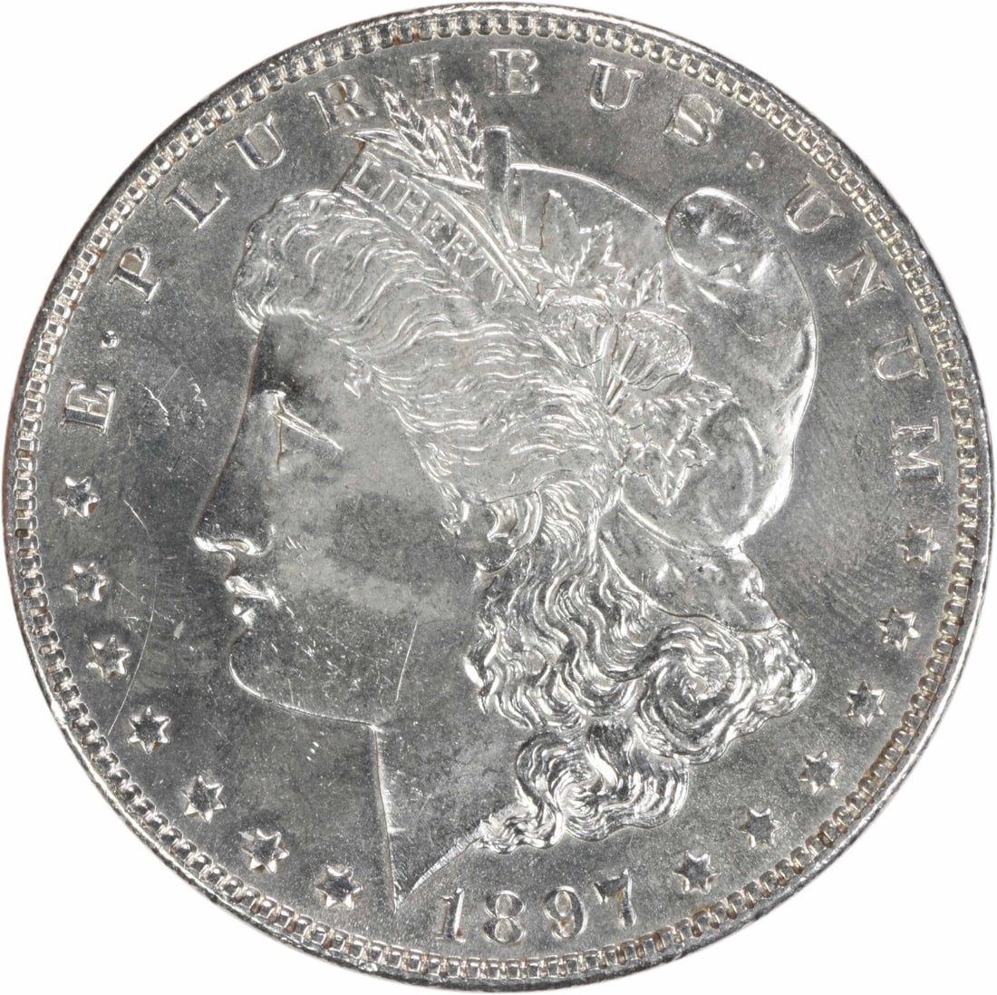 1897 Silver Morgan Dollar Brilliant Uncirculated Uncertified US Coin: 1897 Silver Morgan Dollar Brilliant Uncirculated Uncertified US Coin This 1897 Morgan Silver Dollar is an uncirculated coin in brilliant uncirculated (BU) condition. It is composed of silver, features