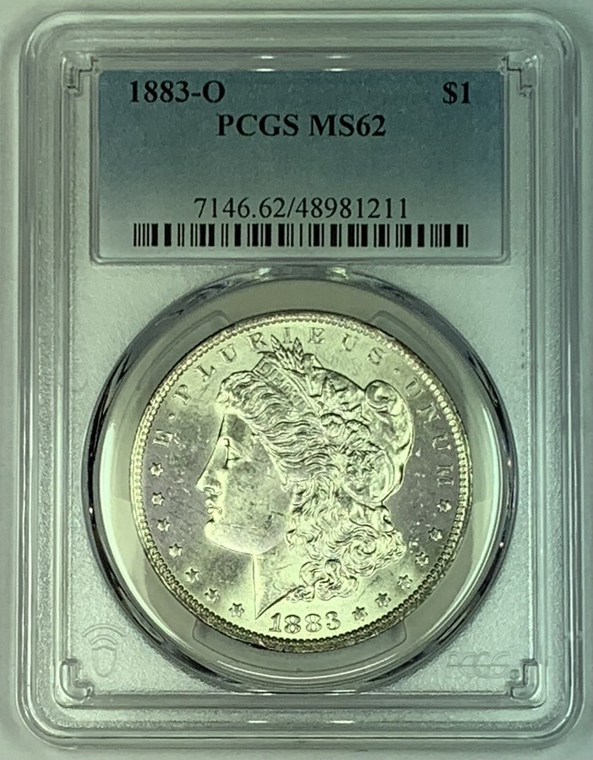 PCGS MS 62 1883-O Morgan Silver Dollar Graded US Coin: PCGS MS 62 1883-O Morgan Silver Dollar Graded US Coin This is an 1883-O Morgan Silver Dollar graded MS 62 by PCGS. The coin is uncirculated and features the iconic Morgan design. It is composed of sil