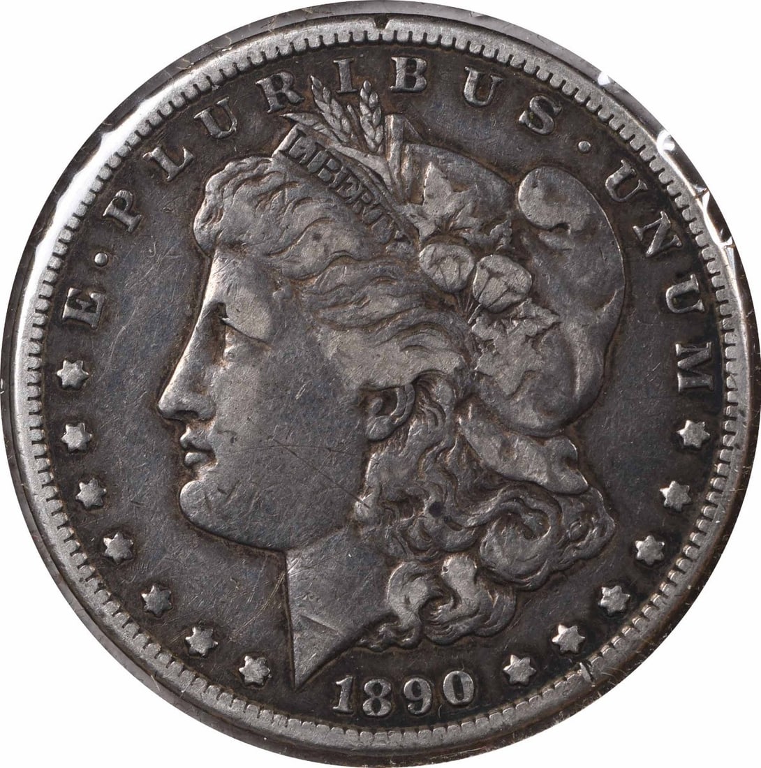 1890-CC Morgan Silver Dollar VF Uncertified 90% Silver Coin: 1890-CC Morgan Silver Dollar VF Uncertified 90% Silver Coin This 1890-CC Morgan Silver Dollar features the iconic design by George T. Morgan, showcasing its historical significance and craftsmanship. 