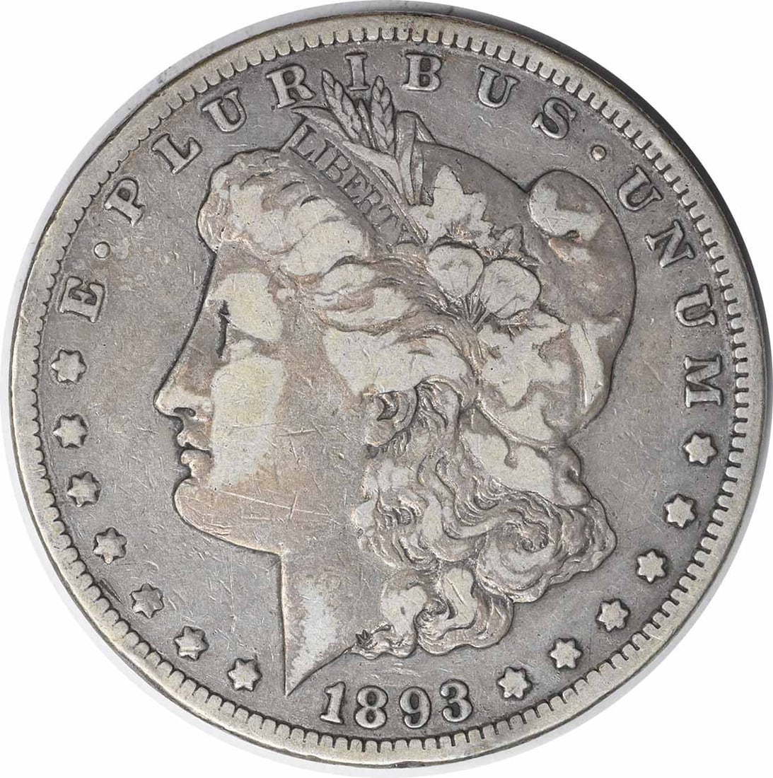 1893-CC Morgan Silver Dollar VF Uncertified 90% Silver Coin: 1893-CC Morgan Silver Dollar VF Uncertified 90% Silver Coin This 1893-CC Morgan Silver Dollar is a remarkable piece of American numismatic history. Crafted in Carson City, this coin features a composi