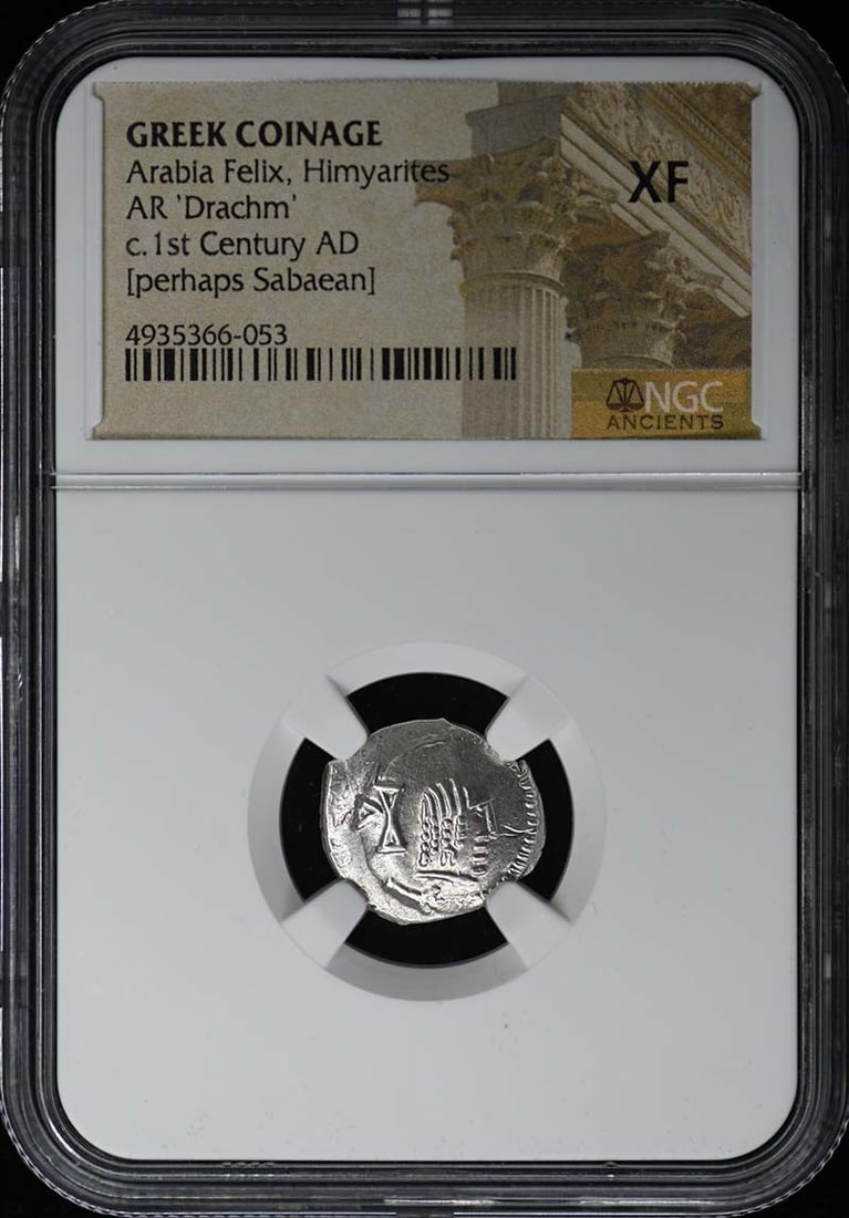 1st Century AD Himyarites Greek Coin AR Drachm NGC XF: 1st Century AD Himyarites Greek Coin AR Drachm NGC XF This 1st Century AD Arabian Felix coin, originating from the Himyarite Kingdom, is a Greek coinage AR Drachm. It has been certified by NGC with a 