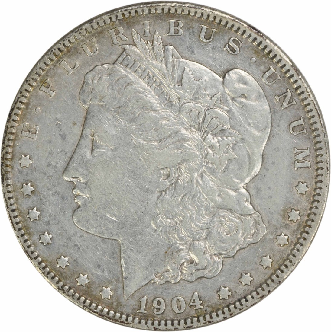 1904 Morgan Silver Dollar EF Uncertified 90% Silver Coin: 1904 Morgan Silver Dollar EF Uncertified 90% Silver Coin This 1904 Morgan Silver Dollar is a fine representation of American numismatic history, featuring the iconic design by George T. Morgan. The co