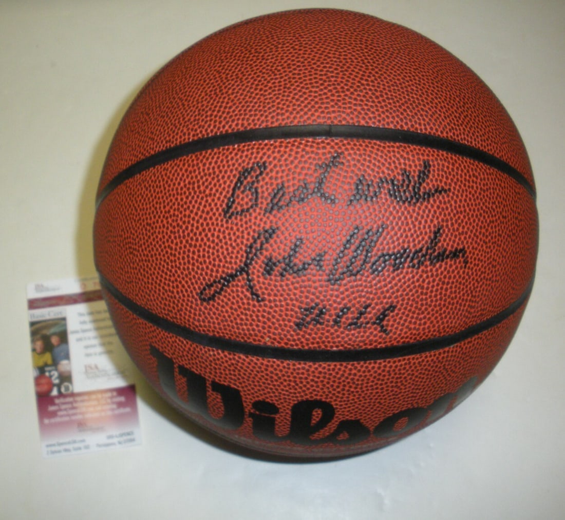 John Wooden Autographed Basketball With JSA COA UCLA Bruins Hall Of Fame: John Wooden Autographed Basketball With JSA COA UCLA Bruins Hall Of Fame This is a basketball autographed by John Wooden, the legendary UCLA Bruins Hall of Fame coach. The ball is an original item, no