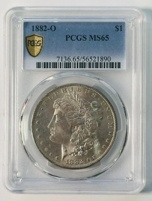 PCGS MS-65 1882-O Morgan Silver Dollar: PCGS MS-65 1882-O Morgan Silver Dollar 1882-O Morgan Silver Dollar graded MS-65 by PCGS. This pre-owned coin is composed of silver and carries a dollar denomination. Specifications Coin Type: Morgan S