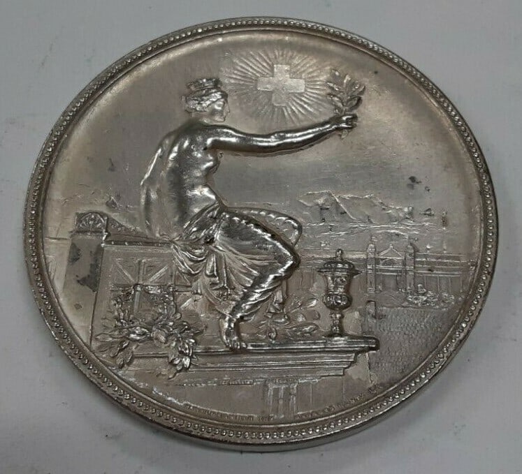 1895 Swiss Silver Shooting Medal Zurich Winterthur 45mm R1756b: 1895 Swiss Silver Shooting Medal Zurich Winterthur 45mm R1756b This is a 45mm silver Swiss Shooting Medal from 1895, commemorating Zurich in Winterthur, Switzerland. Crafted in Switzerland, this pre-o