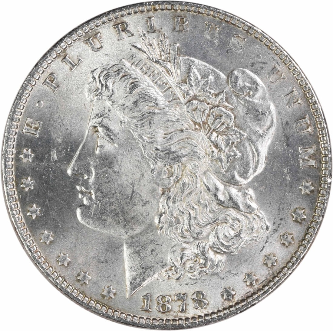 Uncirculated 1878 Morgan Dollar 7 Tail Feathers Reverse Silver Coin: Uncirculated 1878 Morgan Dollar 7 Tail Feathers Reverse Silver Coin This is an 1878 Morgan Silver Dollar featuring the 7 Tail Feathers Reverse of 1878. The coin is uncertified and graded as Choice Bri