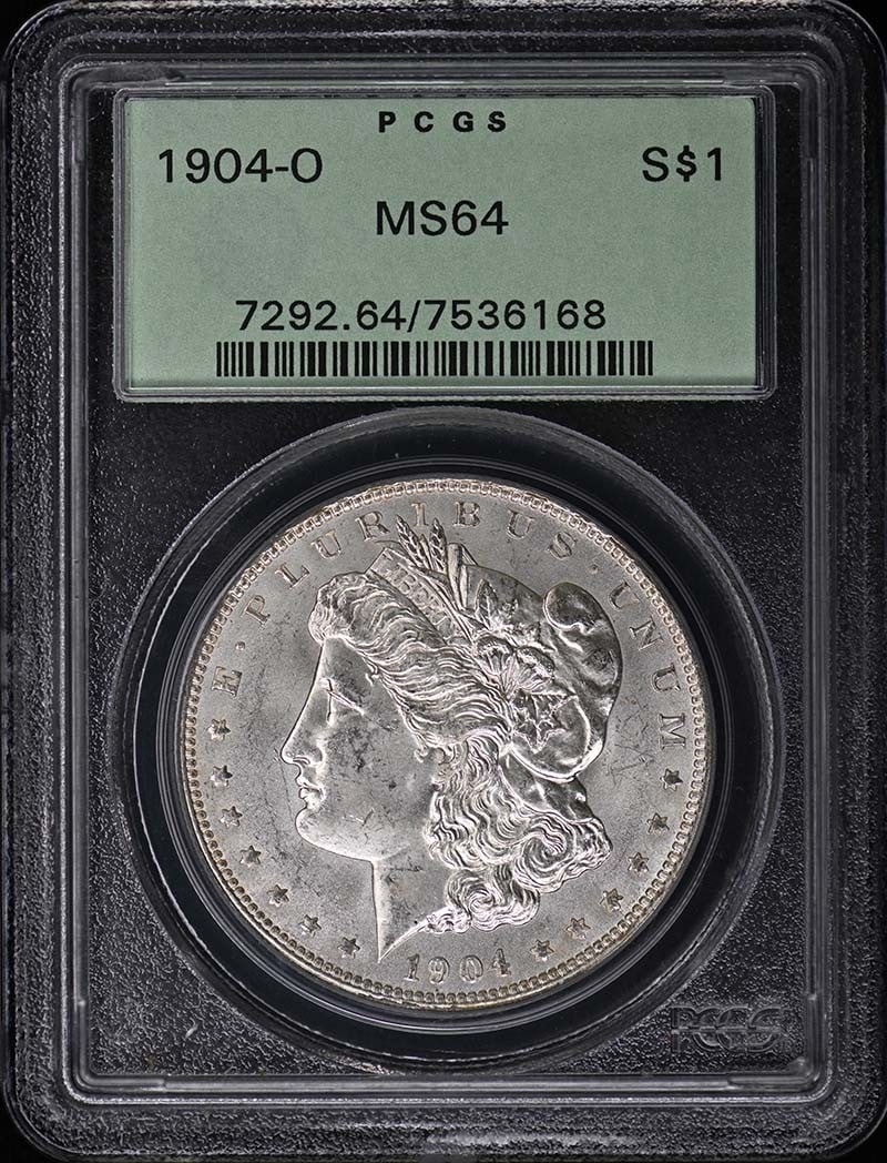 PCGS MS64 1904-O Morgan Silver Dollar New Orleans Mint: PCGS MS64 1904-O Morgan Silver Dollar New Orleans Mint This 1904-O Morgan Dollar is graded MS64 and certified by PCGS. Struck in New Orleans, it is an uncirculated coin from the United States, featuri