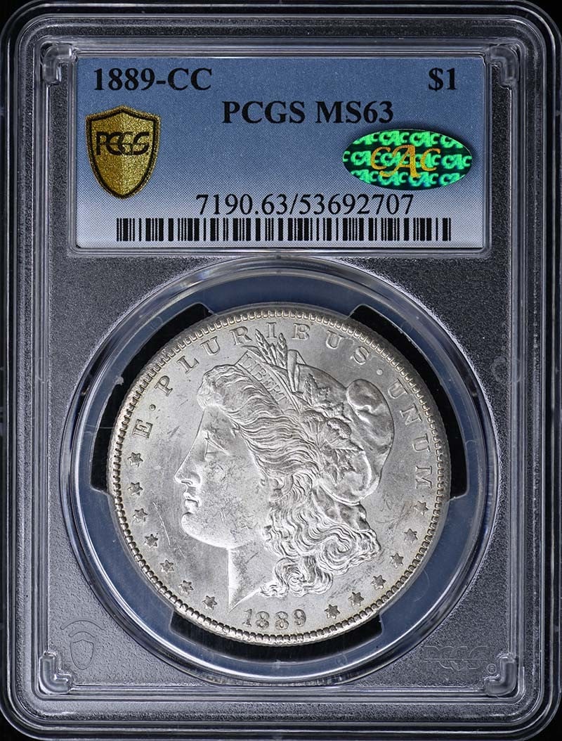 PCGS MS63 CAC 1889-CC Morgan Silver Dollar: PCGS MS63 CAC 1889-CC Morgan Silver Dollar 1889-CC Morgan Dollar certified by PCGS and graded MS63 with CAC approval. This uncirculated United States silver dollar is a pre-owned coin from the Carson 