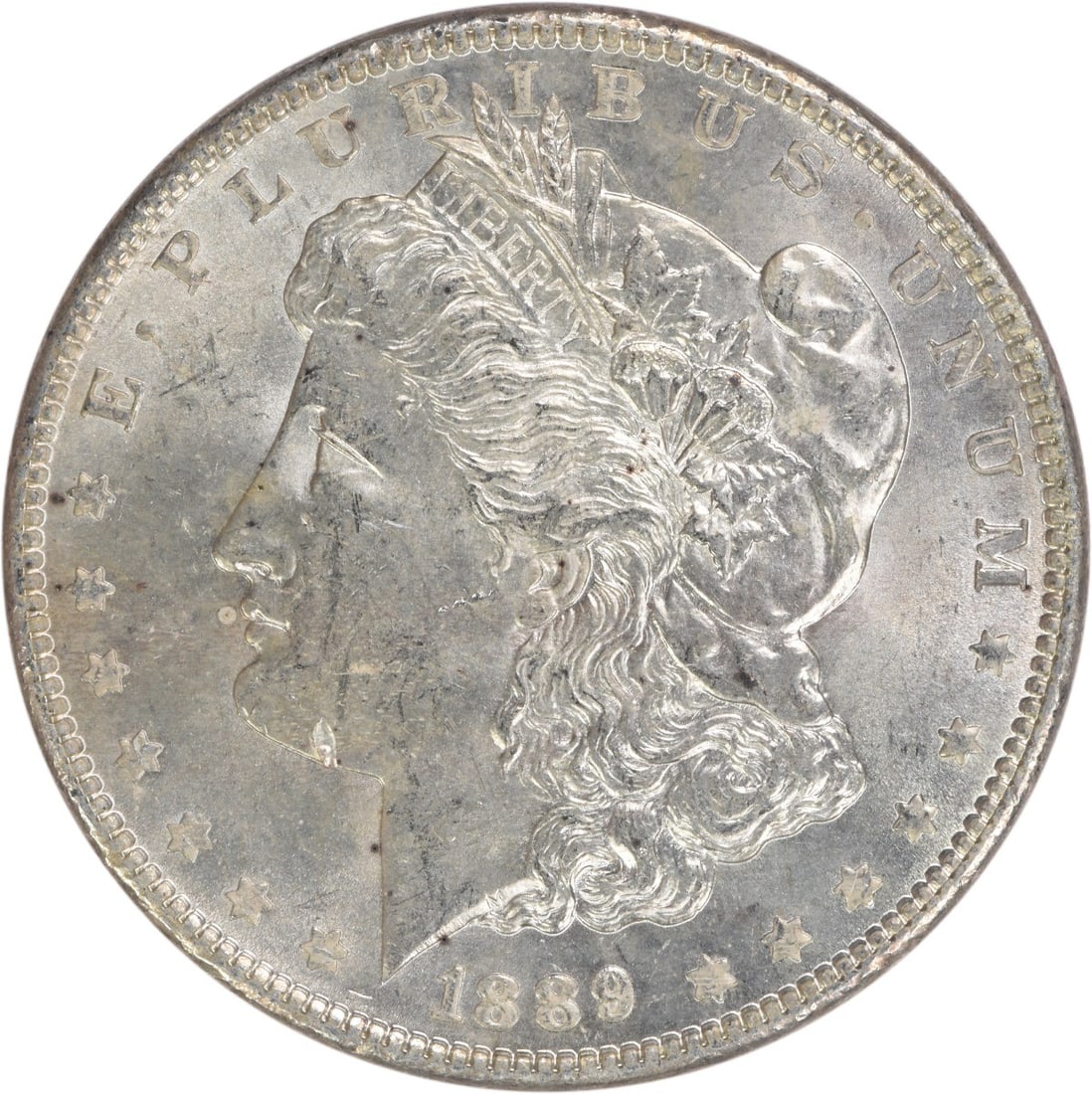 Choice BU 1889 Silver Morgan Dollar Uncirculated Uncertified Coin: Choice BU 1889 Silver Morgan Dollar Uncirculated Uncertified Coin This is an 1889 Morgan Silver Dollar from the United States. The coin is composed of silver, features no mint mark, and is in Choice B
