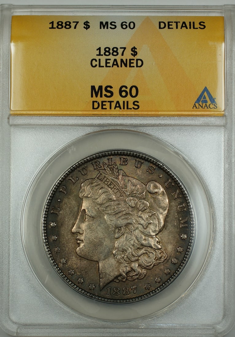 ANACS MS-60 Details 1887 Silver Morgan Dollar Toned Uncirculated Coin: ANACS MS-60 Details 1887 Silver Morgan Dollar Toned Uncirculated Coin This 1887 Morgan Silver Dollar is an uncirculated coin graded MS-60 Details by ANACS. It features a darkly toned surface and was m
