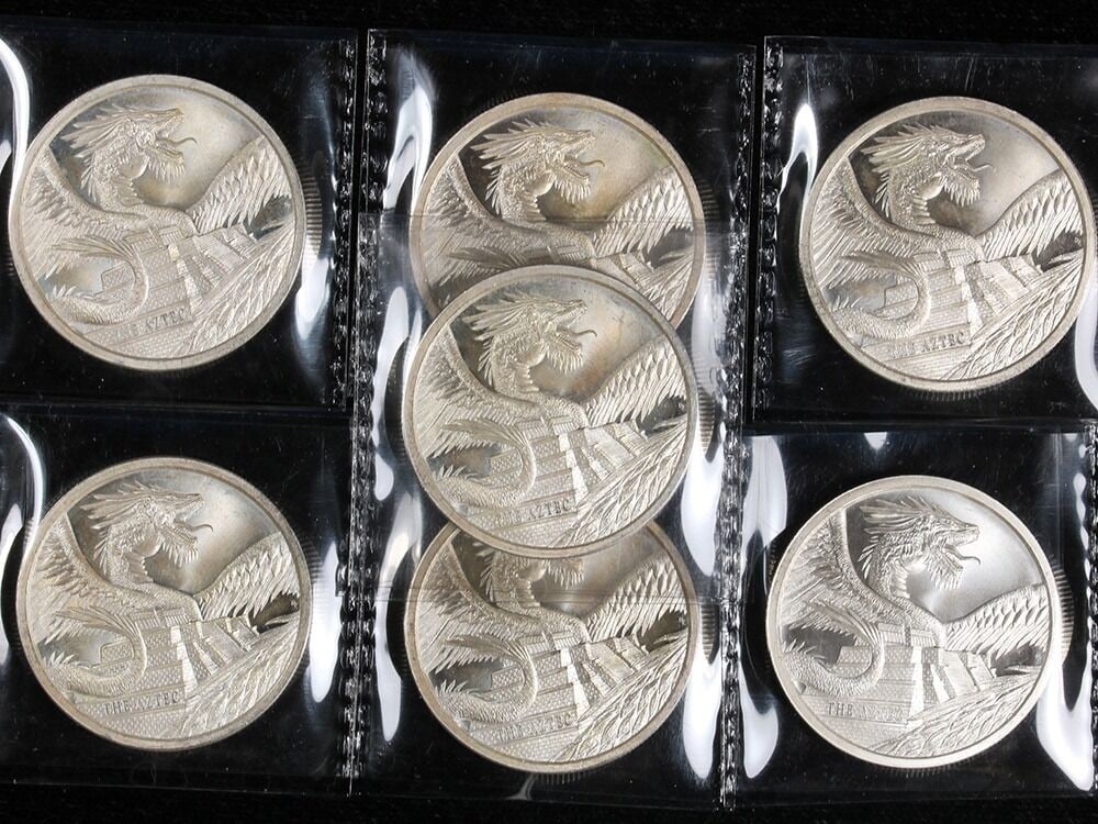 Lot of 7 World of Dragons Aztec 1 Ounce .999 Silver Rounds: Lot of 7 World of Dragons Aztec 1 Ounce .999 Silver Rounds Lot of 7 World of Dragons: The Aztec silver rounds with an attractive dragon series design. These pre-owned rounds are uncirculated and descr