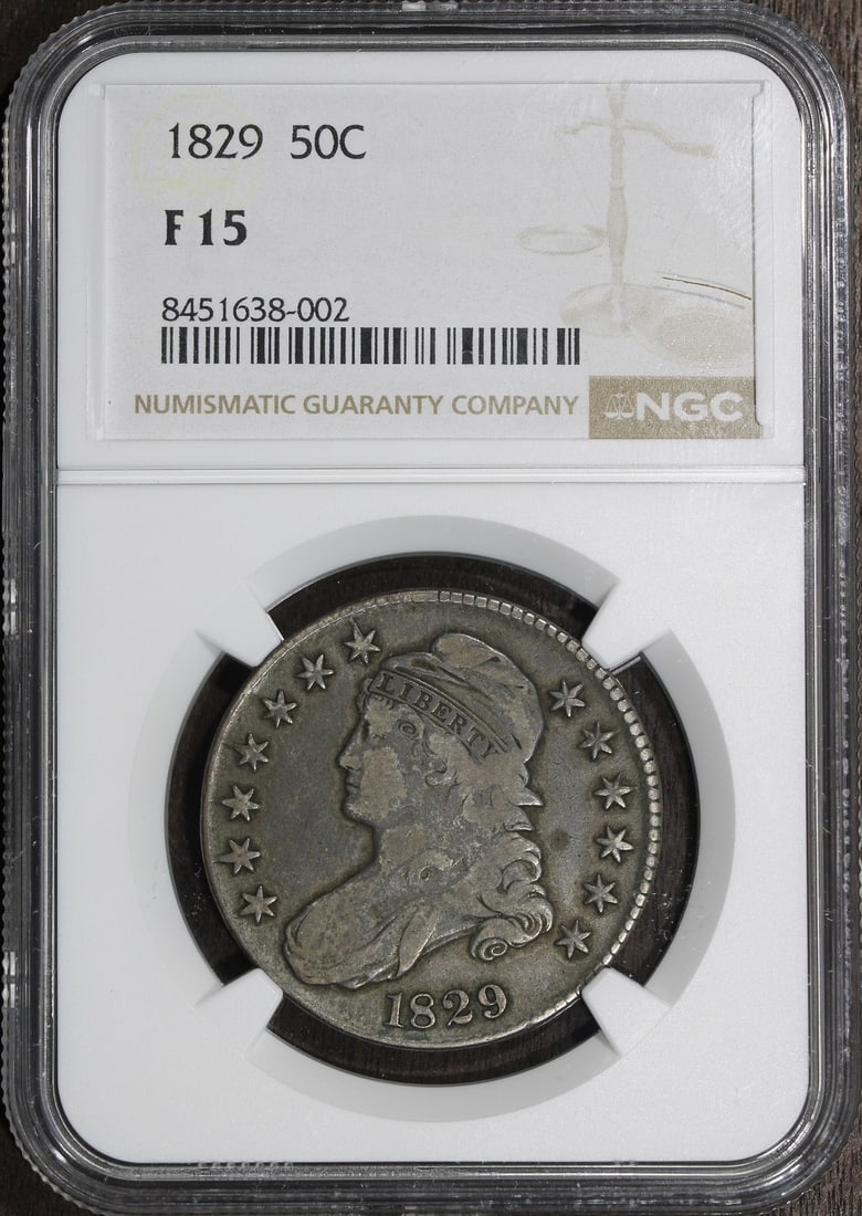 1829 Capped Bust Silver Half Dollar 50C NGC F15: 1829 Capped Bust Silver Half Dollar 50C NGC F15 1829 Capped Bust Half Dollar graded F15 by NGC. This pre-owned United States silver 50C coin features the Capped Bust design and is identified as a Phil