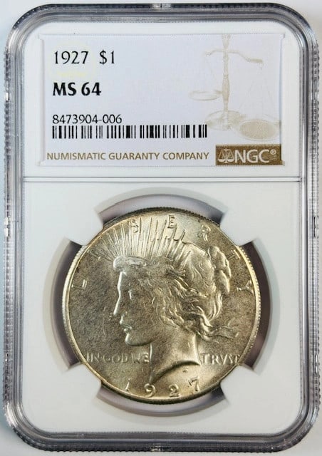 NGC MS 64 1927 Peace Silver Dollar USA: NGC MS 64 1927 Peace Silver Dollar USA 1927 Peace Dollar certified by NGC and graded MS 64. This silver dollar is a pre-owned coin from the United States. Specifications Item Type: Peace Dollar Year: 