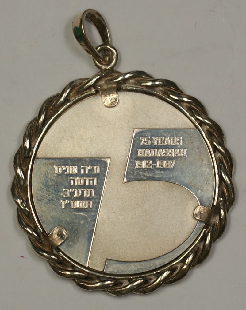 Sterling Silver 1987 Hadassah 75th Anniversary Proof Medal from Israel: Sterling Silver 1987 Hadassah 75th Anniversary Proof Medal from Israel This is a 1987 Israel Hadassah 75th Anniversary proof medal crafted in sterling silver. The piece remains in un-used condition an