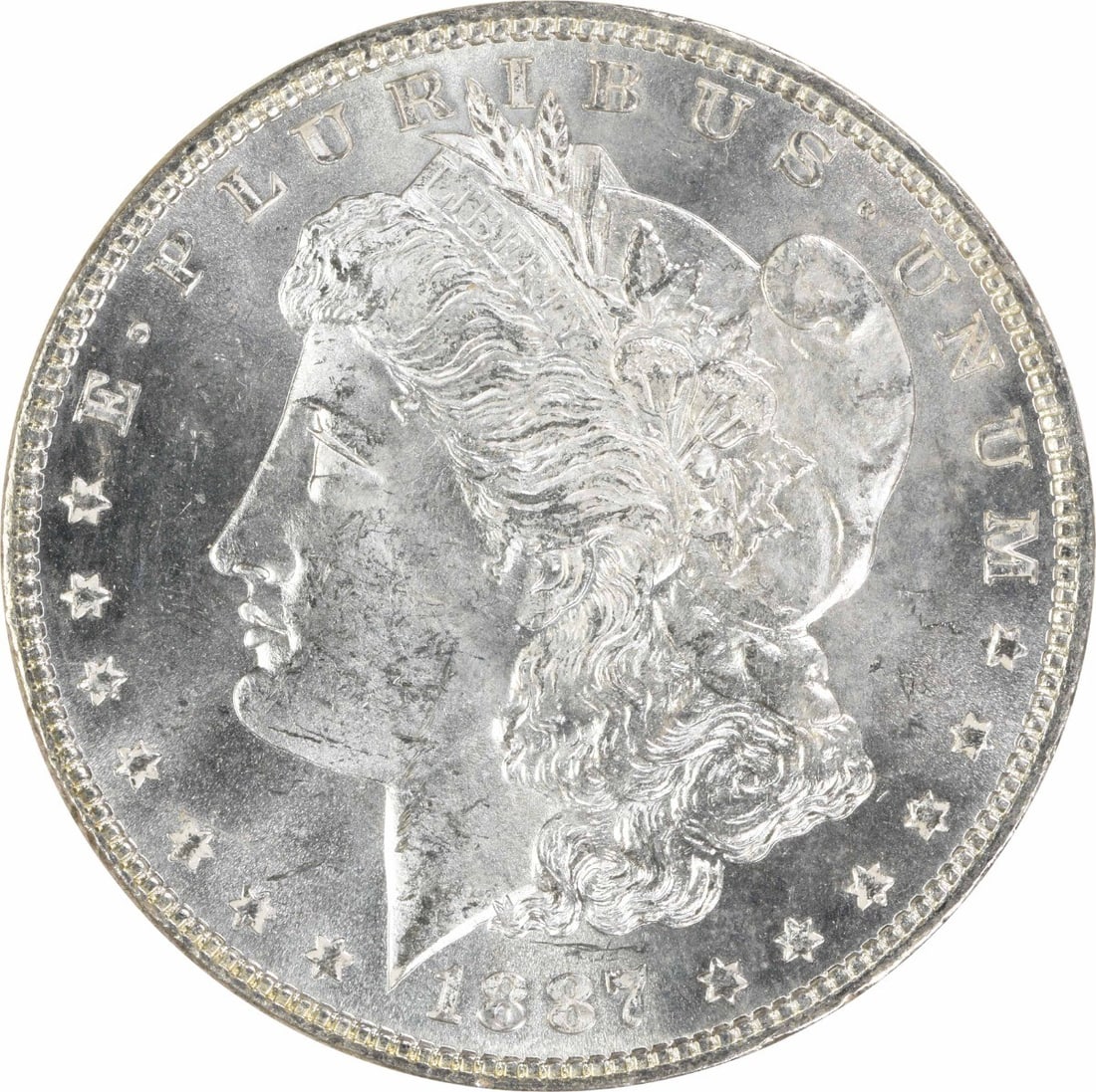 1887 Uncirculated Morgan $1 Silver Coin MS63 Uncertified: 1887 Uncirculated Morgan $1 Silver Coin MS63 Uncertified 1887 Morgan Silver Dollar in uncirculated, pre-owned condition. This uncertified coin is composed of silver and carries a listed grade of MS63.