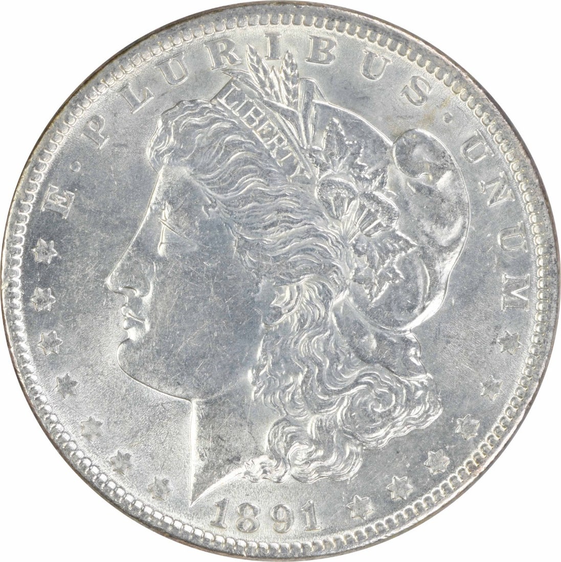 1891 AU Morgan Silver Dollar $1 Uncertified: 1891 AU Morgan Silver Dollar $1 Uncertified 1891 Morgan Silver Dollar in AU grade. This pre-owned coin is uncertified and circulated, with silver composition and a $1 denomination. Specifications Coin