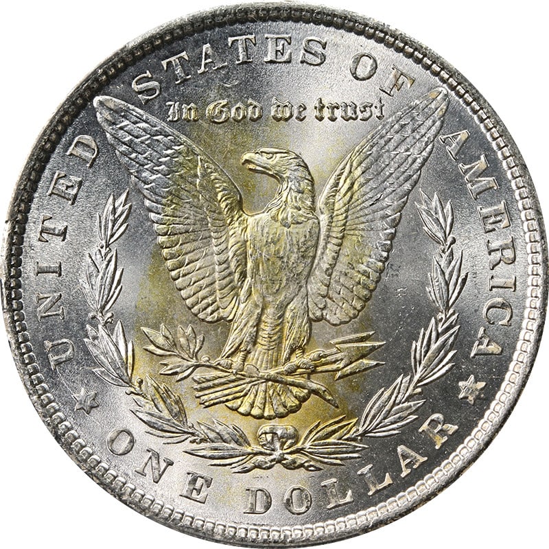 PCGS MS64 1900 Philadelphia Morgan Silver Dollar With Yellow Reverse Toning: PCGS MS64 1900 Philadelphia Morgan Silver Dollar With Yellow Reverse Toning This 1900-P Morgan Silver Dollar is a bright white silver coin with distinctive yellow toning on the reverse. Graded MS64 by