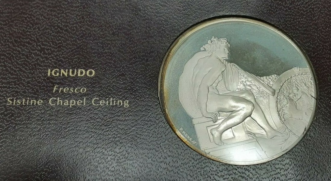 Ignudo Silver Proof Medal from Genius of Michelangelo by Franklin Mint: Ignudo Silver Proof Medal from Genius of Michelangelo by Franklin Mint This Franklin Mint Genius of Michelangelo proof medal features the Ignudo from Michelangelo's Sistine Chapel frescoes. Struck in 