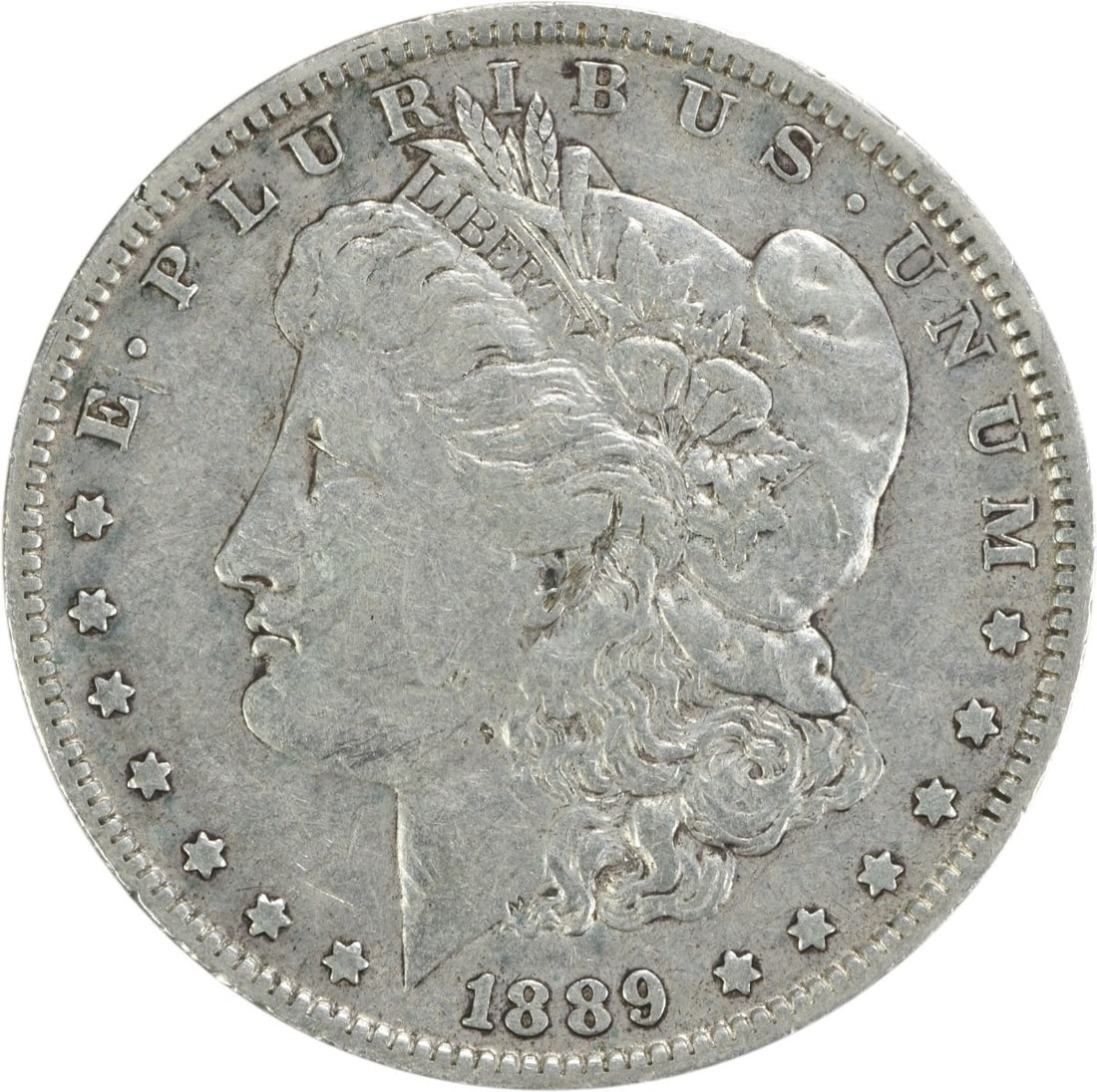 1889-O Morgan Silver Dollar Uncertified George T Morgan Design: 1889-O Morgan Silver Dollar Uncertified George T Morgan Design This 1889-O Morgan Silver Dollar is a remarkable piece of history, showcasing the craftsmanship of designer George T. Morgan. The coin fe