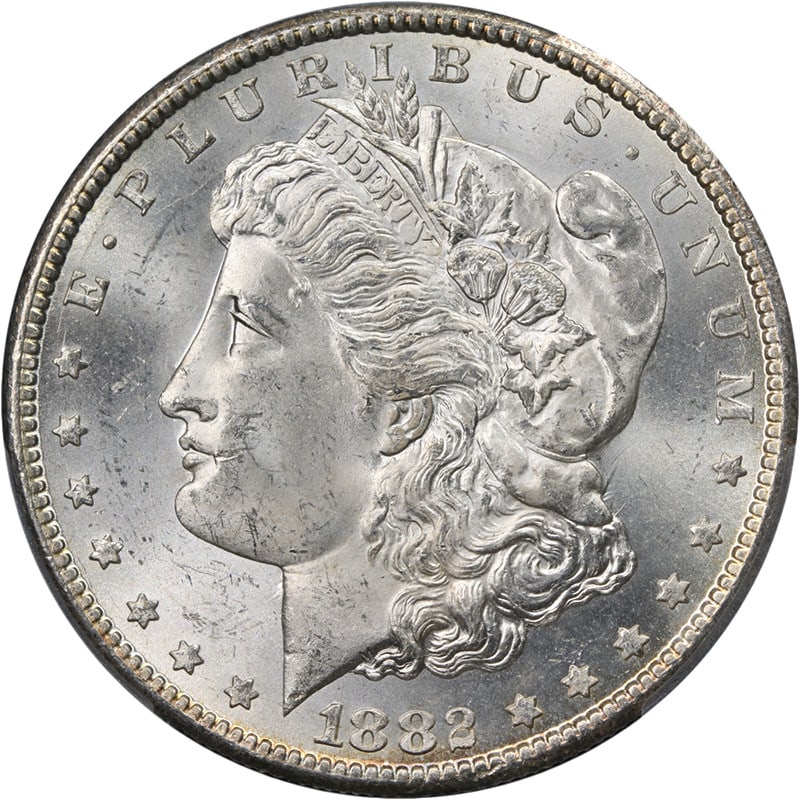 PCGS MS63 1882-CC Morgan Silver Dollar Blast White: PCGS MS63 1882-CC Morgan Silver Dollar Blast White Original 1882-CC Morgan Silver Dollar graded PCGS MS63. This uncirculated silver coin is described as blast white with great eye appeal, fantastic lu