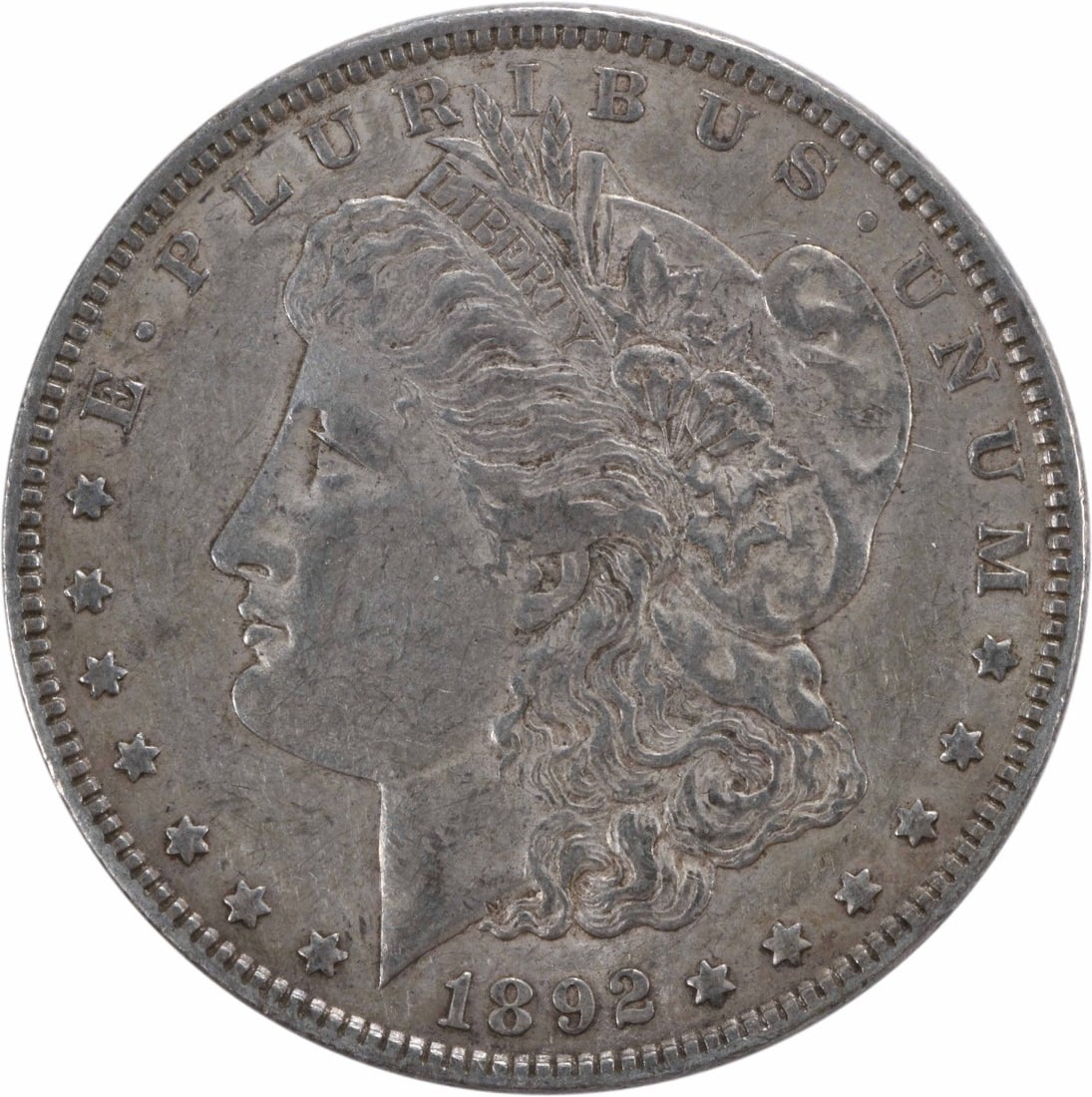 1892 Philadelphia Morgan Dollar 90 Percent Silver Circulated XF Uncertified Coin: 1892 Philadelphia Morgan Dollar 90 Percent Silver Circulated XF Uncertified Coin This 1892 Morgan Silver Dollar from the United States is a circulated coin featuring the design by George T. Morgan. St