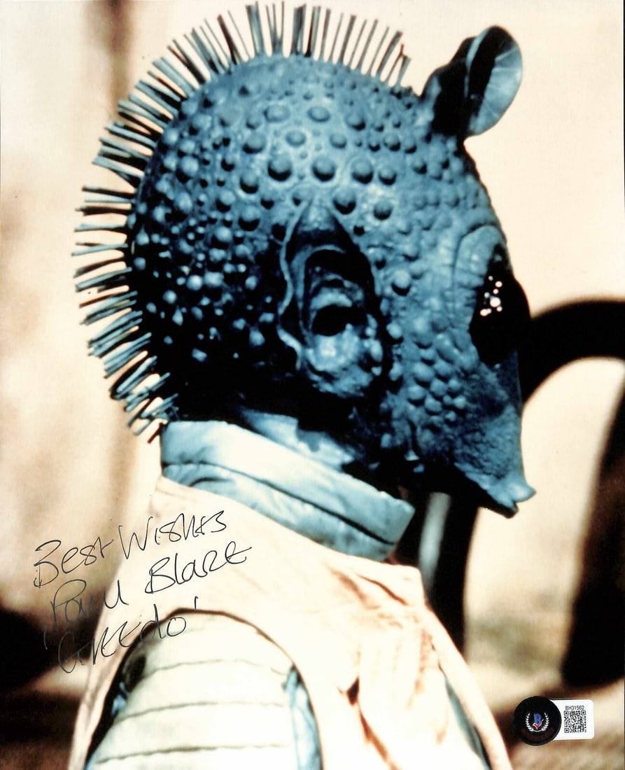Signed 8x10 Photo Paul Blake as Greedo with Inscription Beckett Authenticated: Signed 8x10 Photo Paul Blake as Greedo with Inscription Beckett Authenticated This is an autographed 8x10 photograph signed by Paul Blake, who portrayed Greedo in Star Wars: A New Hope. The photo is i