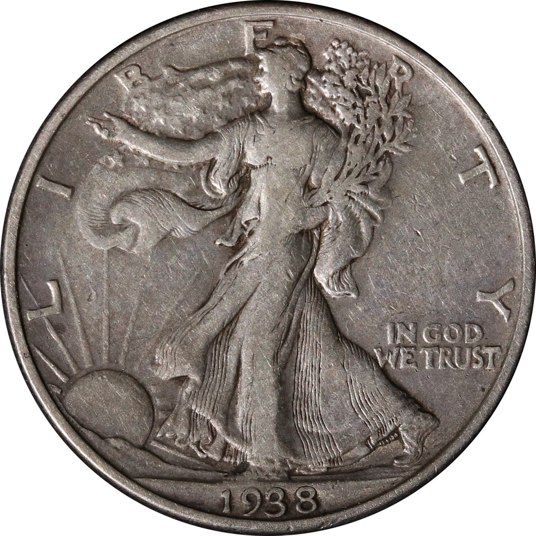 1938 Denver Mint Silver Walking Liberty Half Dollar Coin United States: 1938 Denver Mint Silver Walking Liberty Half Dollar Coin United States This 1938-D Walking Liberty Half Dollar was minted in Denver and is composed of silver. The coin is circulated and remains uncert