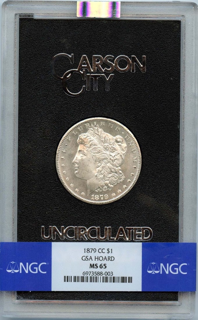 NGC MS65 1879 Carson City Morgan Dollar GSA Hard Pack: NGC MS65 1879 Carson City Morgan Dollar GSA Hard Pack This 1879-CC Morgan Silver Dollar is part of the GSA Hoard and comes in the original Carson City hard pack. Graded MS65 by NGC, it was minted in C