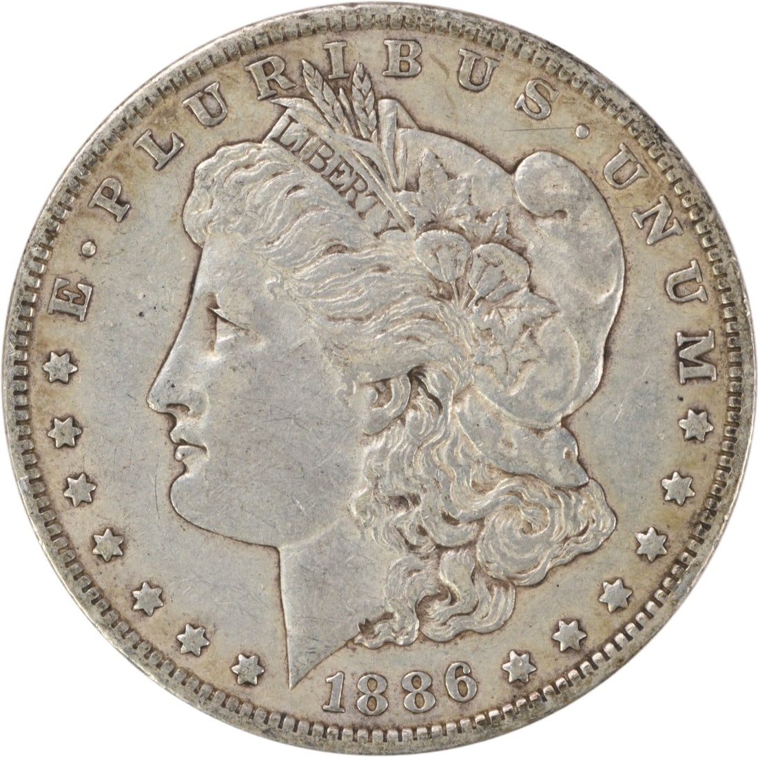 1886-O Morgan Silver Dollar EF Uncertified New Orleans Coin: 1886-O Morgan Silver Dollar EF Uncertified New Orleans Coin This 1886-O Morgan Silver Dollar is a classic piece of numismatic history, featuring a design by renowned engraver George T. Morgan. Struck 