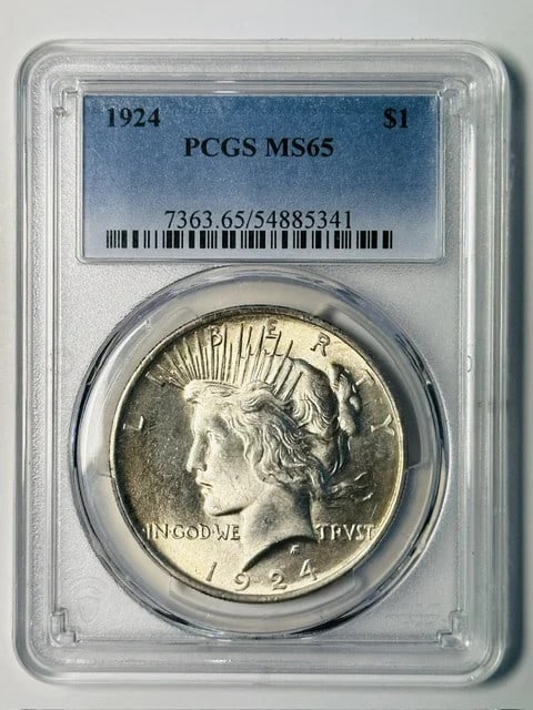 PCGS MS-65 1924 Peace Silver Dollar Philadelphia Mint: PCGS MS-65 1924 Peace Silver Dollar Philadelphia Mint 1924 Peace Dollar certified by PCGS and graded MS-65. This pre-owned silver dollar was struck in the USA and is identified as a Philadelphia issue