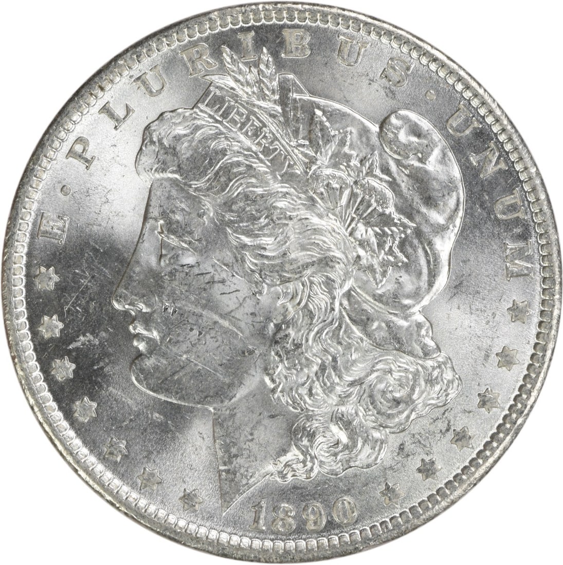 Uncirculated 1890 Silver Dollar Morgan Type Brilliant Uncertified Example: Uncirculated 1890 Silver Dollar Morgan Type Brilliant Uncertified Example This is an uncirculated 1890 Morgan Silver Dollar, featuring brilliant uncirculated (BU) condition. The coin is composed of si