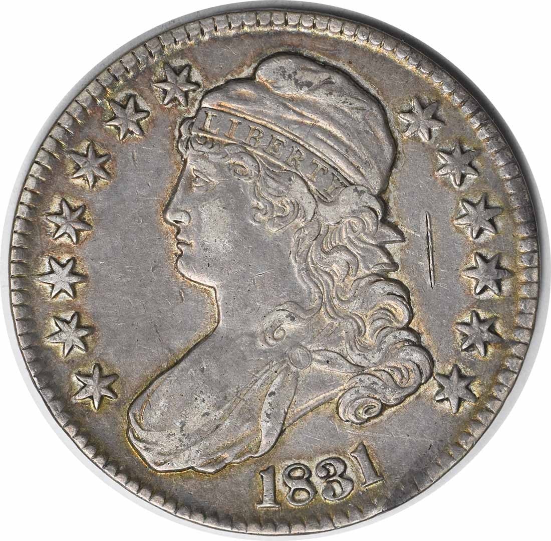 1831 Bust Half Dollar by John Reich 50C Uncertified Coin: 1831 Bust Half Dollar by John Reich 50C Uncertified Coin This 1831 Bust Half Dollar is a remarkable piece of numismatic history, showcasing the artistry of designer John Reich. With a composition of 8