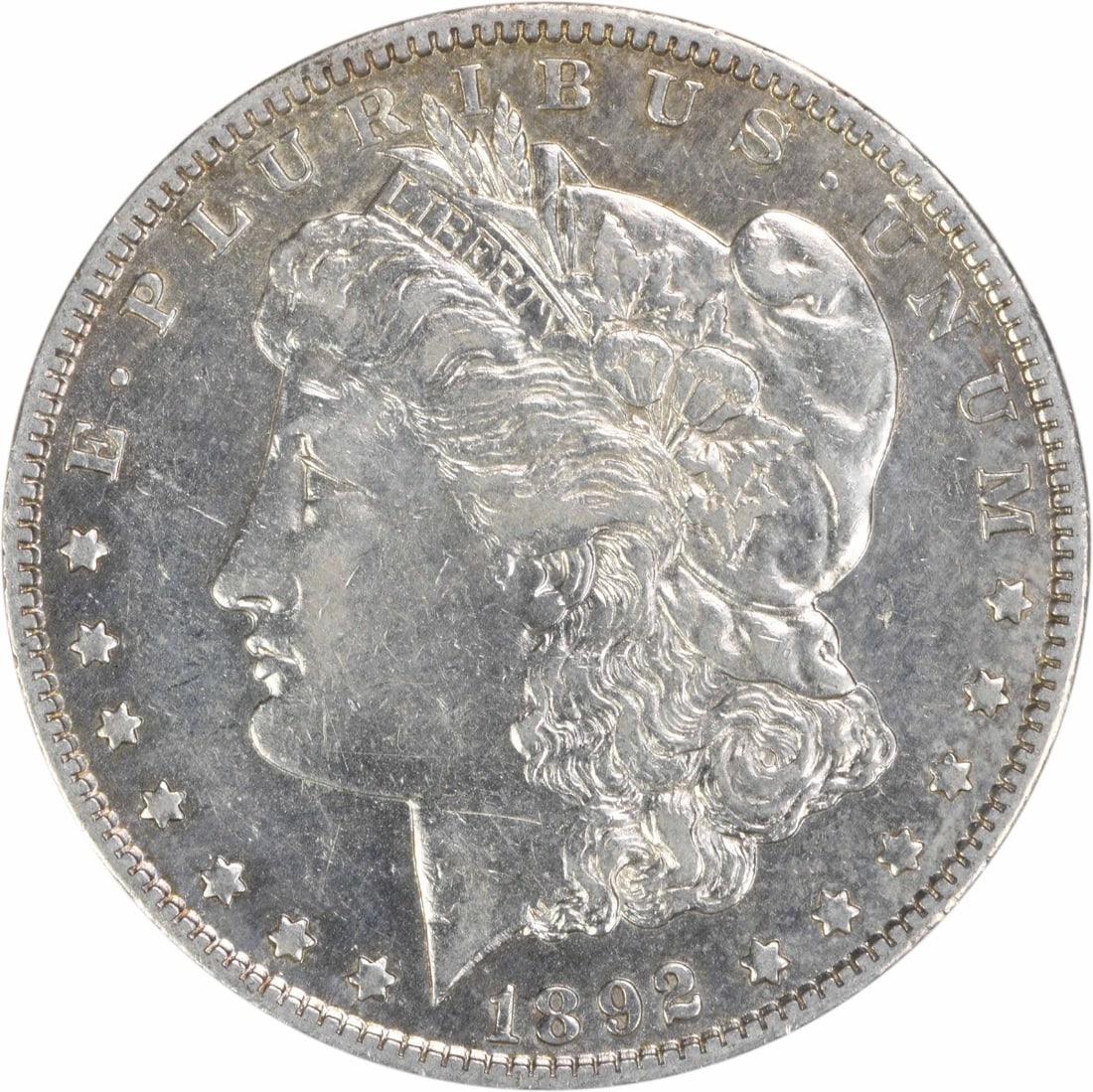 1892 New Orleans Morgan Dollar Extra Fine Silver Uncertified Coin: 1892 New Orleans Morgan Dollar Extra Fine Silver Uncertified Coin This 1892-O Morgan Silver Dollar was minted in New Orleans and features a composition of 90% silver and 10% copper. Designed by George