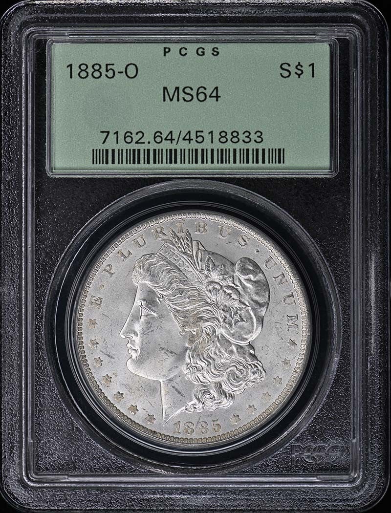 PCGS MS64 1885-O Morgan Silver Dollar OGH: PCGS MS64 1885-O Morgan Silver Dollar OGH This 1885 Morgan Dollar was minted in New Orleans and is graded MS64 by PCGS. The coin is uncirculated and comes in an Old Green Holder (OGH). It is a pre-own