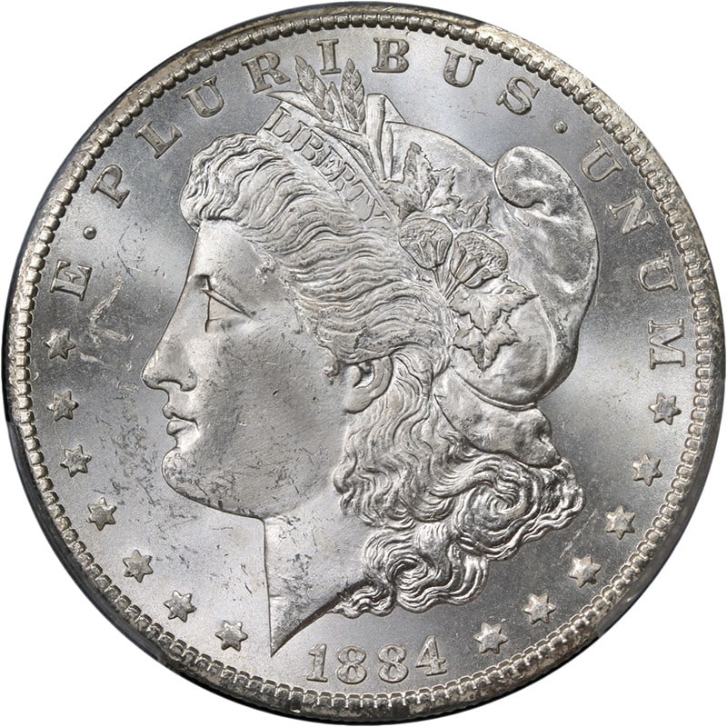 PCGS MS63 1884 CC Morgan Silver Dollar Blast White: PCGS MS63 1884 CC Morgan Silver Dollar Blast White Original 1884-CC Morgan Silver Dollar graded PCGS MS63. This uncirculated silver coin is described as blast white with great eye appeal, fantastic lu
