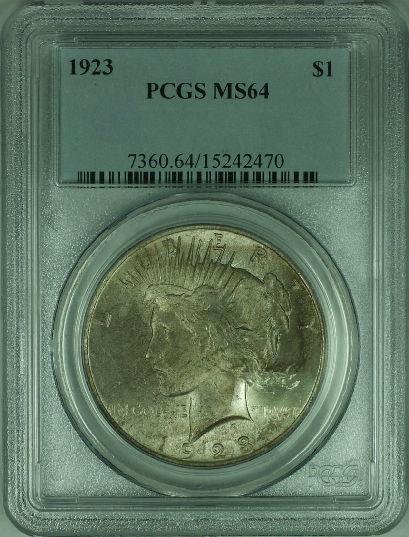 PCGS MS64 1923 Peace Dollar Silver Coin With Obverse Toning: PCGS MS64 1923 Peace Dollar Silver Coin With Obverse Toning This is a 1923 Peace Silver Dollar $1 coin from the United States, certified by PCGS with a grade of MS-64. The coin features notable obvers
