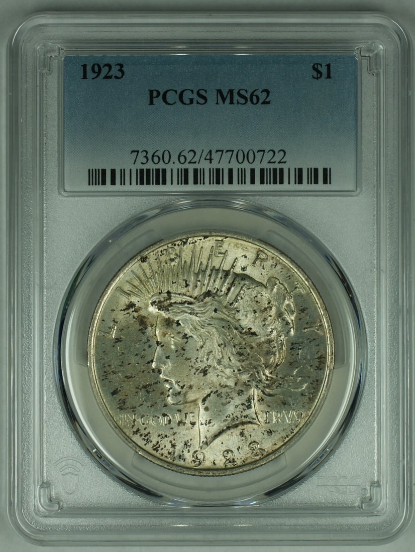 PCGS MS 62+ 1923 Peace Silver Dollar Toned Uncirculated $1 Coin: PCGS MS 62+ 1923 Peace Silver Dollar Toned Uncirculated $1 Coin This is a 1923 Peace Silver $1 Dollar coin from the United States, graded MS 62+ by PCGS. The coin is uncirculated and features attracti
