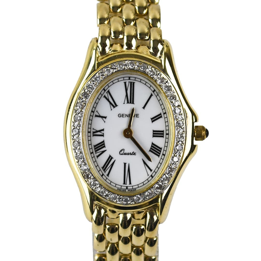 Geneve 14K Yellow Gold Oval Wristwatch with Diamond Bezel 24mm: Geneve 14K Yellow Gold Oval Wristwatch with Diamond Bezel 24mm Women's Geneve wristwatch in 14k yellow gold with a diamond bezel and oval white dial. This bracelet-style watch is Swiss made and featur
