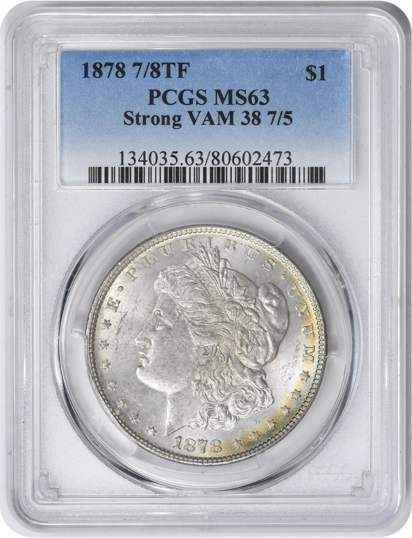 PCGS MS63 Morgan Dollar 1878 7/8 Tailfeather VAM 38 Variety Silver Coin: PCGS MS63 Morgan Dollar 1878 7/8 Tailfeather VAM 38 Variety Silver Coin This 1878 Morgan Silver Dollar features the rare 7/8 Tail Feathers VAM 38 7/5 variety. Graded MS63 by PCGS, this coin is uncircu