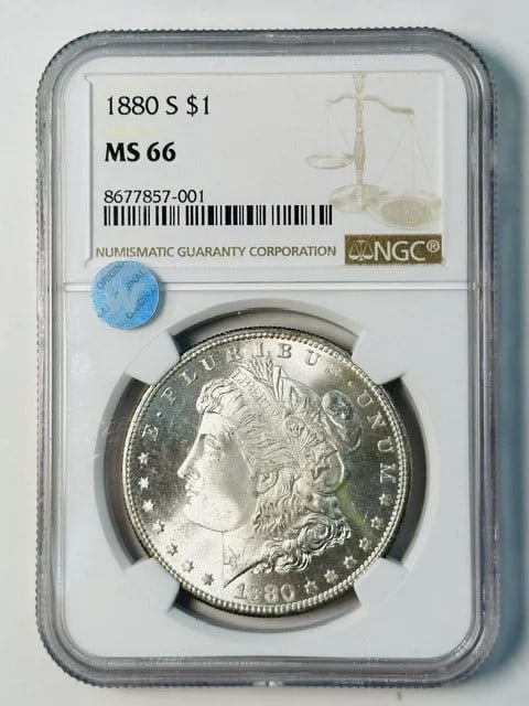 NGC MS 66 1880 S Morgan Silver Dollar Sight White: NGC MS 66 1880 S Morgan Silver Dollar Sight White 1880-S Morgan Silver Dollar certified by NGC and graded MS 66. The original description notes a sight white appearance. Pre-owned. Specifications Coin