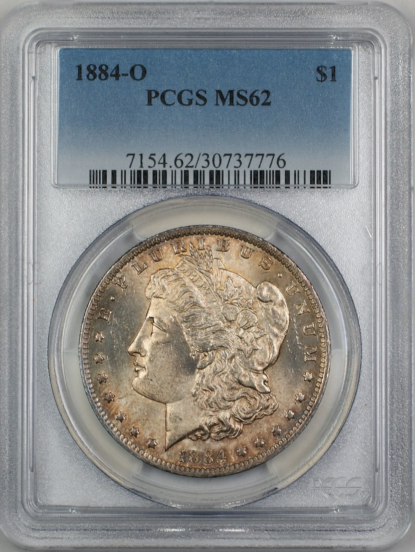 PCGS MS62 1884-O Morgan Silver Dollar with Toning Uncirculated: PCGS MS62 1884-O Morgan Silver Dollar with Toning Uncirculated This is an 1884-O Morgan Silver Dollar graded MS-62 by PCGS. Minted in New Orleans, this uncirculated coin is composed of silver and feat