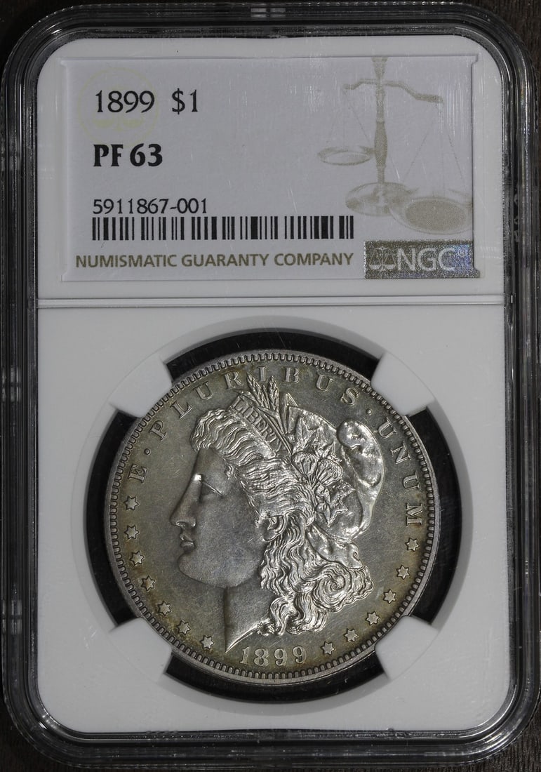 NGC PF63 1899 Morgan Silver Dollar Proof $1: NGC PF63 1899 Morgan Silver Dollar Proof $1 1899 Morgan Silver Dollar proof coin graded PF63 by NGC. This pre-owned United States $1 coin is struck in 90% silver and identified as a proof issue. Speci
