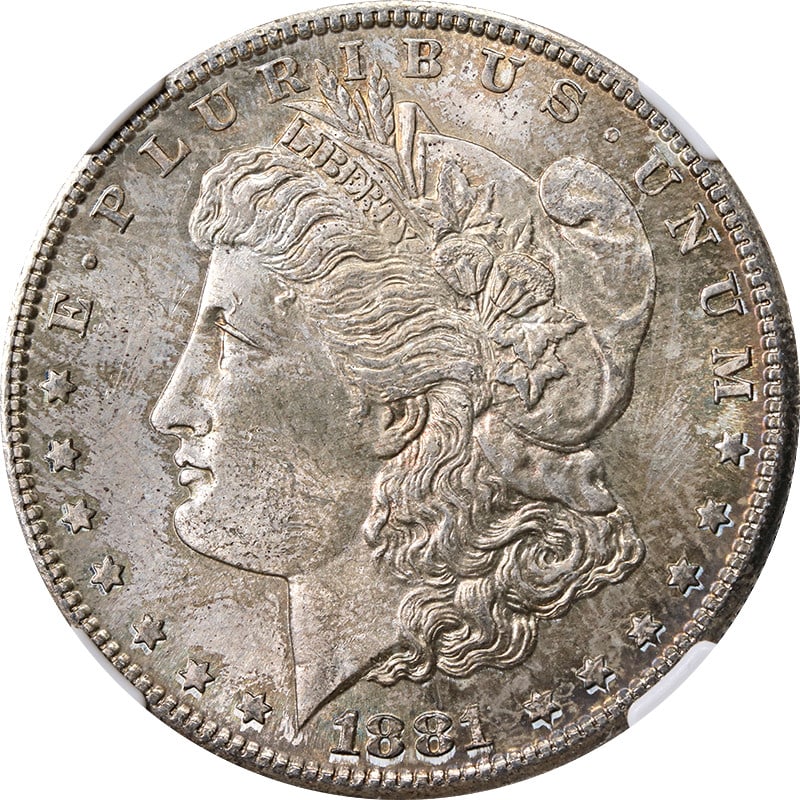 NGC MS63 1881 San Francisco Morgan Dollar with Toned Surface: NGC MS63 1881 San Francisco Morgan Dollar with Toned Surface This 1881-S Morgan Silver Dollar is certified by NGC with an MS63 grade. Struck in silver with a fineness of 0.9, the coin features toning 