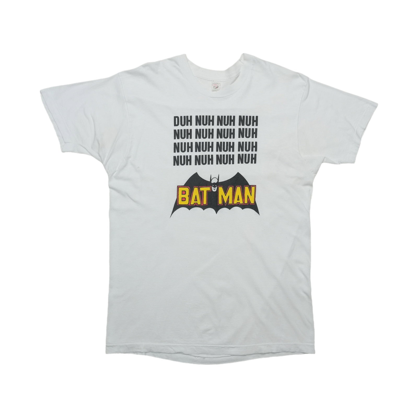 Vintage 1980s Batman Cotton White T Shirt: Vintage 1980s Batman Cotton White T Shirt This is an original vintage Batman "Duh Nuh Nuh" shirt from the 1980s. Made from 100% cotton, the shirt features front graphics only and has no graphics on th