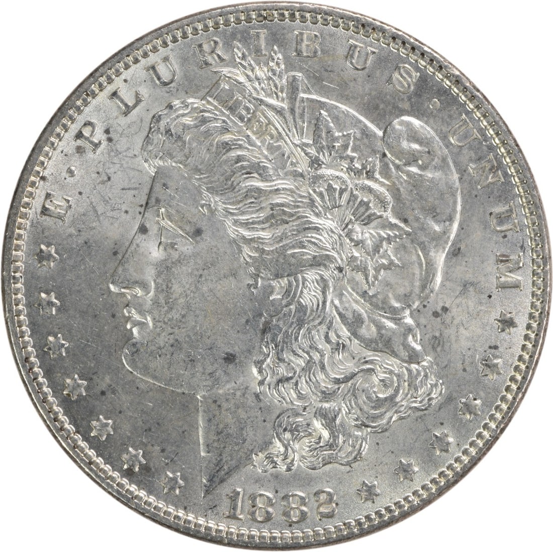Brilliant Uncirculated 1882 Morgan Silver Dollar Philadelphia Mint No Mark: Brilliant Uncirculated 1882 Morgan Silver Dollar Philadelphia Mint No Mark This is an 1882 Morgan Silver Dollar from the United States, featuring a bright uncirculated (BU) grade. The coin is composed